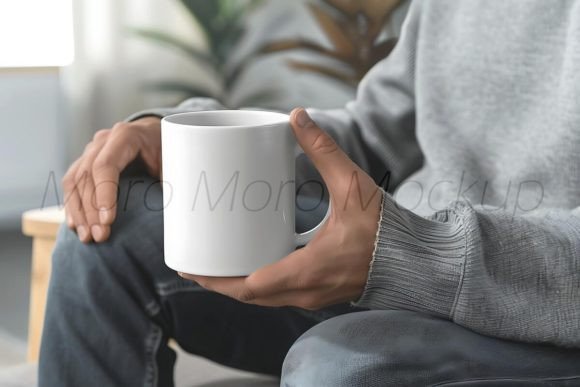 Man Holding White Coffee Mug Mockup